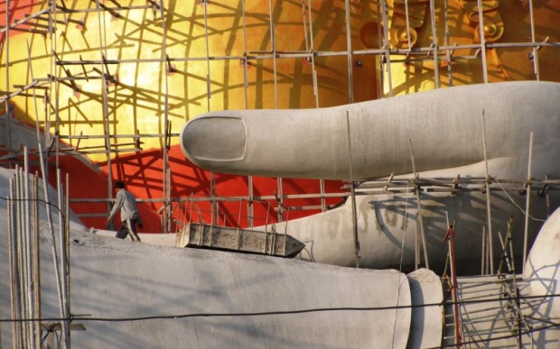 The Buddha being built